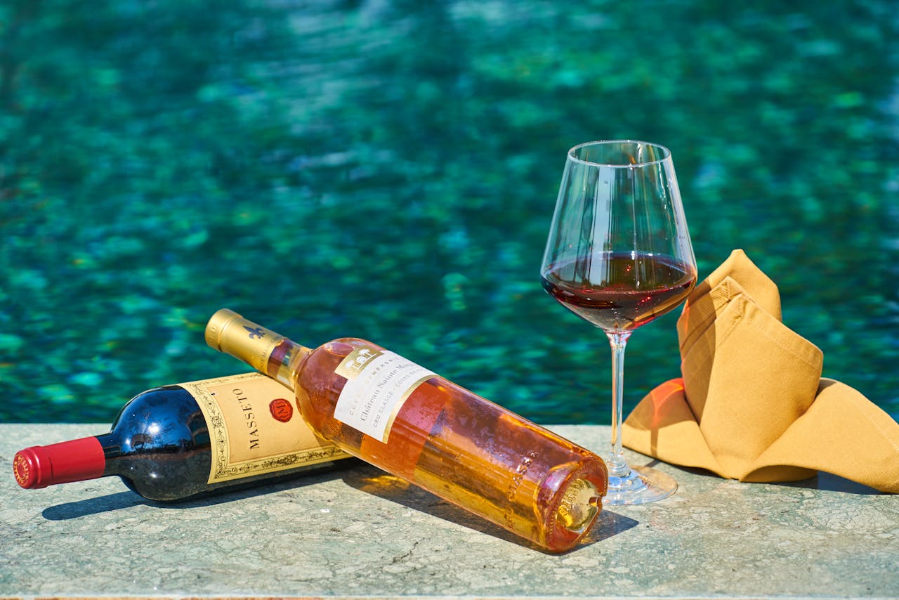 Sophisticated wine setting by the pool, perfect for relaxation and celebration.